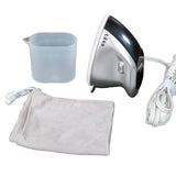 A compact electric steamer iron set on a white background, including a silver and black steamer head, white cord with plug, a translucent plastic cup, a light gray drawstring pouch, and a white fabric cleaning cloth.