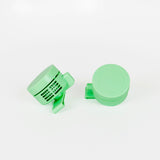 A pair of light mint green plastic fans.